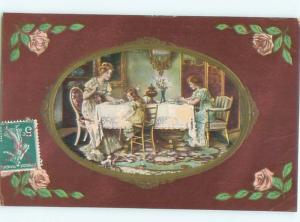foreign c1910 Postcard GIRLS AND MOM SITTING AT THE TABLE AC3783