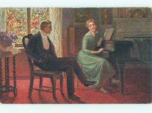 foreign c1910 Postcard MAN WATCHES WOMAN SITTING AT GRAND PIANO AC3894