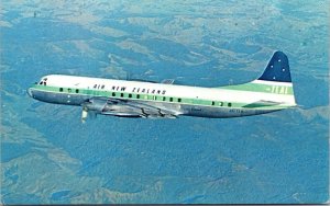 Postcard Air New Zealand Jet Prop Electra Airliner Airplane in Flight