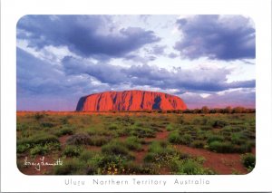 Postcard Australia - Uluru at sunset with storm clouds