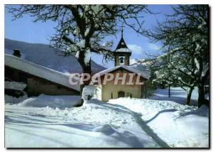 Modern Postcard In a village Mountain Little Chapel in the Snow