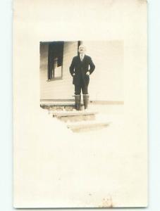 Pre-1949 rppc FUNNY LOOK - MAN IN SUIT WEARING KNEE HIGH BOOTS o2145