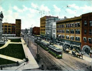 1909 East Side Square Bloomington Illinois IL Cow Milking Trolley Postcard 