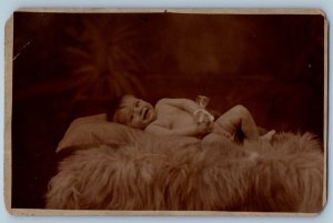 c1910's Nude Baby On Bearskin Fur Studio RPPC Photo Posted Antique Postcard