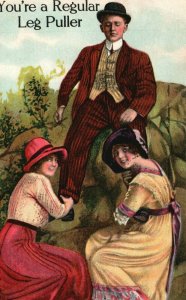 Vintage Postcard 1910s You're Regular Leg Puller Man with Two Woman Pulling Leg