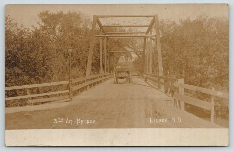 Lisbon North Dakota~Boys in Horse Wagon on 5th Street Bridge~c1912 RPPC 