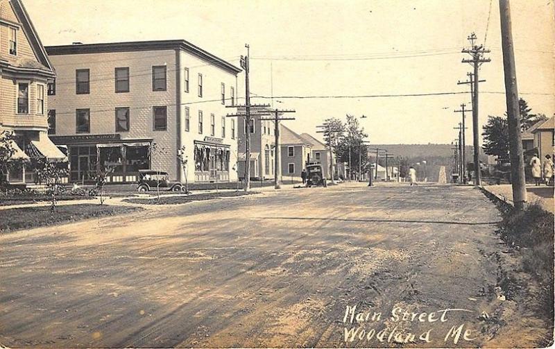 Woodland ME Dirt Street View Storefronts RPPC Postcard