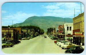 CODY, WY Wyoming ~ Park County ~ MAIN STREET SCENE Coke c1950s Cars Postcard