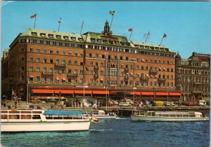 Postcard Sweden Stockholm - Grand Hotel - exterior view with boats