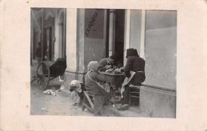 People Sewing Street Scene Real Photo Antique Postcard J66455