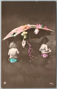 MULTIPLE BABIES UNDER UMBRELLA ANTIQUE REAL PHOTO POSTCARD w/ BELGIAN STAMP RPPC