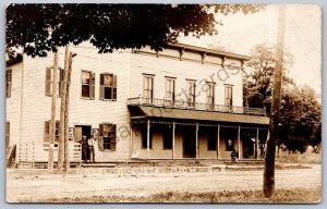 K47/ Augusta Michigan RPPC Postcard c1910 Hotel Building Tavern Beer Sign 186