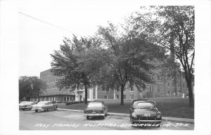 Postcard RPPC 1950s Iowa Estherville autos Holy Family Hospital IA24-1281