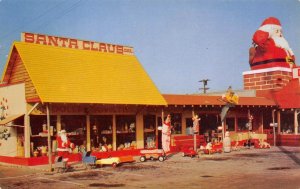 TOYLAND Santa Claus, CA Roadside Store Pedal Car '50s Christmas Vintage Postcard