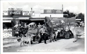 RPPC PRITCHETT, CO ~ Orville Ewing MILDRED & CHARLES CAFE Covered Wagon Postcard