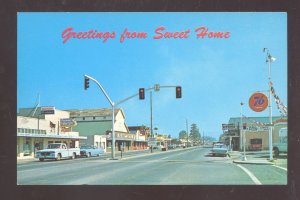 SWEET HOME OREGON DOWNTOWN STREET SCENE OLD CARS STORES VINTAGE POSTCARD