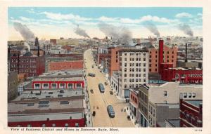 BUTTE MONTANA VIEW OF BUSINESS DISTRICT TROLLEY~MINES IN DISTANCE POSTCARD 1930s