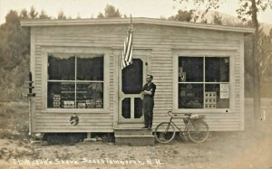 E. L. Mason's Store Owner Bicycle Products in Windows Real Photo Postcard
