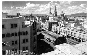 Guadalajara Edifico Lutecia Ave. Colon with Old Cars RPPC Postcard