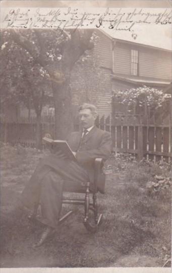 Man Posing In Chair Reading Book 1907 Coshocton Ohio  Real Photo