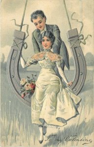 PFB Embossed Valentine Postcard 5486 Beautiful Couple in Silver Horseshoe Swing