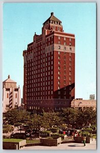 El Paso Texas~Mills Plaza Hotel Tower~Sign~Red Bldg~Park~People~1950s Postcard