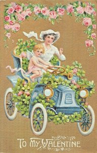 YOUNG BLONDE GIRL ANGEL DRIVING CAR WITH WOMAN IN WHITE DRESS-VALENTINE POSTCARD