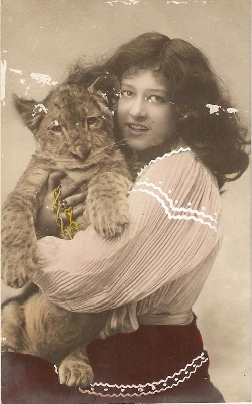 \Lady holding lion cub\ Antique postcard