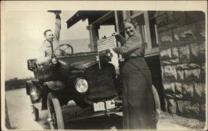 Man & Woman Pose w/ Early Car Auto & American Flag c1910 Real Photo Postcard