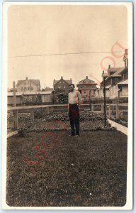 c1900s Town Backyard RPPC Man in Garden Fence Real Photo Postcard Houses Vtg A84