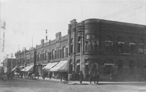 J49/ Marion Iowa RPPC Postcard c1910 Main Street Stores Bank Ice Cream Soda 311