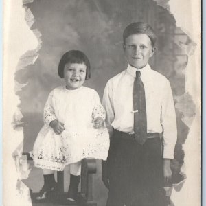 c1910s Cute Handsome Boy & Smile Little Girl RPPC Real Photo PC Cushing, OK A121