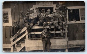 RPPC Mystery Location ~ GROUP of 16 YOUNG MEN & BOYS in OVERALLS c1910s Postcard