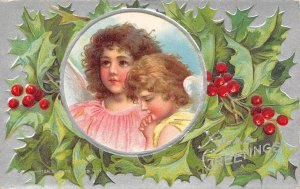 Christmas Greetings Angel Children Surrounded By Hollies Vintage Postcard U8472