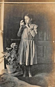 GIRL WITH SMALL BIRD PARAKEET ON HER HAND~1910s REAL PHOTO POSTCARD