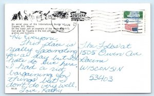 International border with USA at TIJUANA MEXICO Postcard