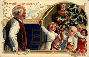 Christmas - Father Watches Happy Children WORTH THE MONEY c1910 Postcard