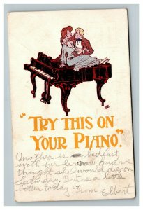 Vintage 1907 Comic Postcard - Woman & Man Embrace Sitting on Grand Piano