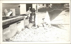 From a Utica NY Man w/ Hammer Wheelbarrow c1910 Real Photo Postcard