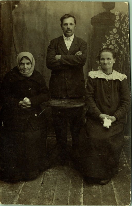 RPPC Unhappy Man Women Head Scarf  Real Photo Postcard