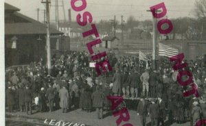 Tracy MINNESOTA RPPC 1918 WW1 SOLDIERS Leaving DEPOT Train Station FLAGS CROWD