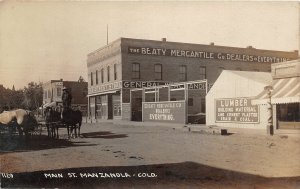 J10/ Manzanola Colorado RPPC Postcard c1910 Main Street Beaty Store 217