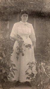 RPPC  Pretty Lady Picking Flowers in Garden    Postcard
