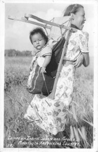 Chippewa mother and papoose Minn Arrowhead Country Rppc postcard 1930s
