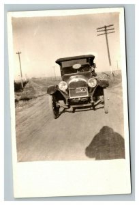 Vintage 1910's RPPC Postcard Antique Car on Road Man Hangs out Window