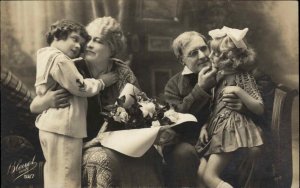 Grandparents with Little Boy and Girl Grandchildren c1910 Real Photo Postcard