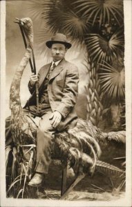 Bizarre  Studio Image Man Riding Ostrich Taxidermy c1910 Real Photo Postcard