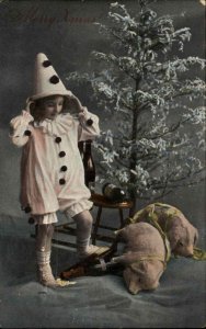 Christmas Little Girl Clown Pierrot Costume Toy Pigs c1910 Gel Postcard