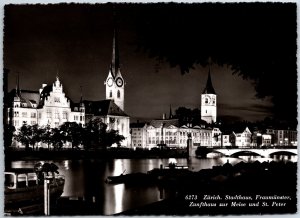 VINTAGE POSTCARD CONTINENTAL SIZE REAL PHOTO OF ZURICH WATERFRONT AT NIGHT SWISS