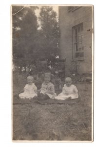 Real Photo Three Babies Sitting Outside